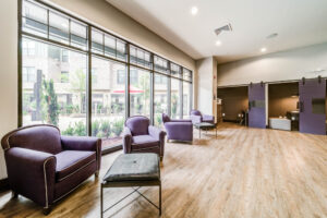 Study lounge with chairs and individual study rooms