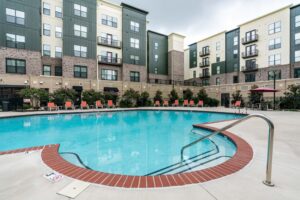 Swimming pool courtyard surrounded by apartment buildings