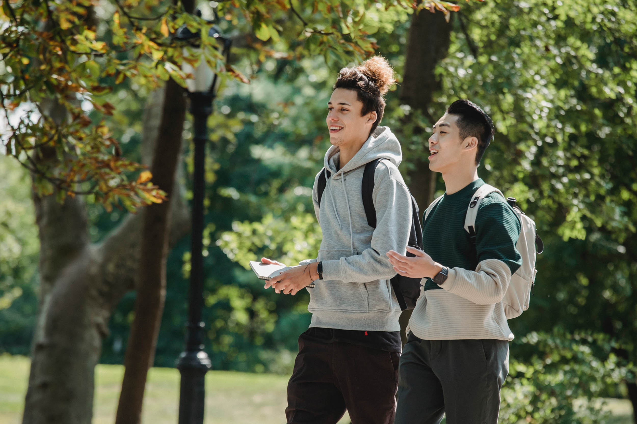 Two college students walking to class